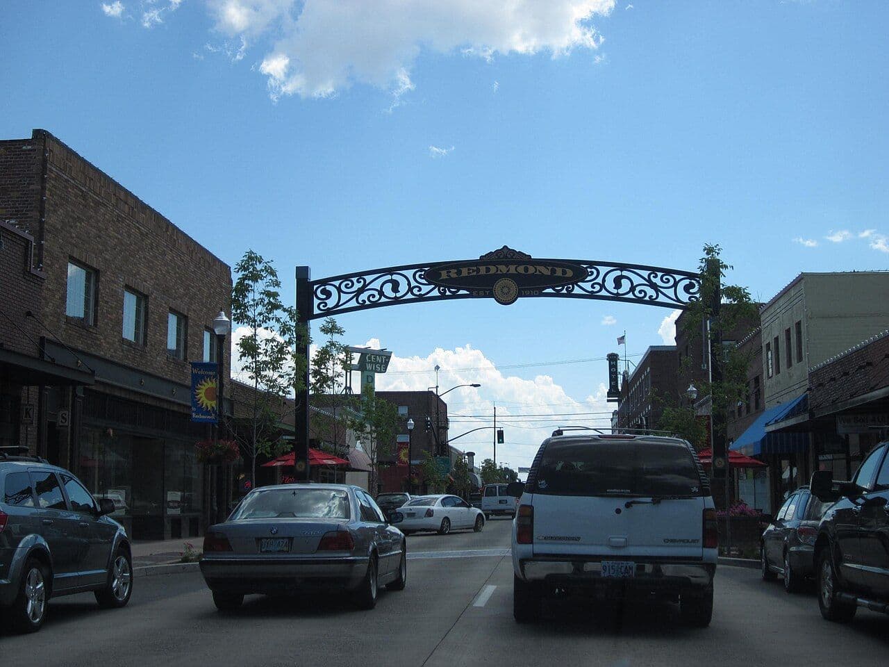 Business Highway 97 through downtown Redmond, passing under the city's decorative welcome arch.